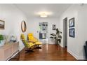 Cozy living room showcasing hardwood floors, stylish yellow chairs, and modern decor at 1682 Grace Se St, Atlanta, GA 30316