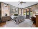 Cozy bedroom featuring neutral tones, plush bedding, and private access to the outdoors at 4530 Upland Court, Cumming, GA 30040