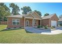 Charming brick home with a well-maintained lawn and inviting front entrance at 686 Stark St, Lawrenceville, GA 30046
