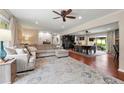 Spacious living room with a ceiling fan and sliding doors to the backyard at 1533 High Haven Ne Ct, Atlanta, GA 30329