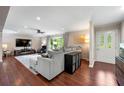 Open-concept living room boasting hardwood floors and a sliding glass door at 1533 High Haven Ne Ct, Atlanta, GA 30329