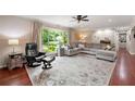 Spacious living room with a large window and hardwood floors at 1533 High Haven Ne Ct, Atlanta, GA 30329