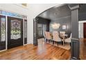 Inviting dining room features hardwood floors, decorative light fixture, and sophisticated decor at 414 Dogwood Way, Canton, GA 30114