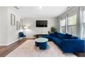 Bright living room with a plush blue sofa and stylish decor at 1025 Cherryfield Run, Marietta, GA 30008