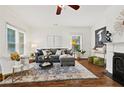 Cozy living room featuring hardwood floors, a comfortable sofa, and abundant natural light at 2089 College Ne Ave, Atlanta, GA 30317