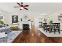 Sunlit living room boasts beautiful hardwood floors, fireplace, and an open floor plan at 2089 College Ne Ave, Atlanta, GA 30317