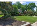 Charming two-story home with a well-manicured lawn and lush landscaping at 3231 Connemara Trce, Lawrenceville, GA 30044