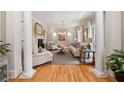 Elegant living room with fireplace, hardwood floors, and neutral decor at 3894 Land O Lakes Ne Dr, Atlanta, GA 30342