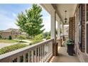 Inviting front porch with white railing, offering serene views of the surrounding neighborhood at 4371 Wigley Preserve Dr, Marietta, GA 30066