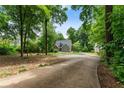 Set back on a large lot, this home offers great privacy and a long, inviting driveway at 1920 Pilgrim Rd, Cumming, GA 30040