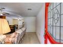 View of the home's entryway with a decorative glass door and a glimpse into the living room at 4544 Ridgeview Dr, Powder Springs, GA 30127