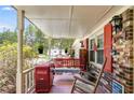 Charming front porch with a swing and a Coca-Cola cooler, perfect for relaxing at 4544 Ridgeview Dr, Powder Springs, GA 30127