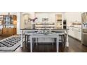 Elegant kitchen with white cabinetry, granite countertops, and stainless steel appliances at 11375 Crestview Ter, Johns Creek, GA 30024