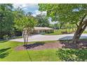 Well-maintained front yard leading to a charming single-story home with covered parking at 3248 Wildwood Sw Dr, Marietta, GA 30060
