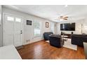 Bright living room featuring hardwood floors, neutral walls, and contemporary furnishings at 3248 Wildwood Sw Dr, Marietta, GA 30060