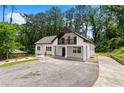 Attractive two-story home showcasing a welcoming balcony, new landscaping, and a generously sized driveway with ample parking at 1887 Shalimar Dr, Atlanta, GA 30345