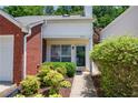 Close-up of a home entrance with a well manicured garden and inviting curb appeal at 2507 Albion Farm Way, Duluth, GA 30097
