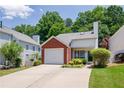 Home with attached garage, and lush, mature trees in a well-maintained neighborhood at 2507 Albion Farm Way, Duluth, GA 30097