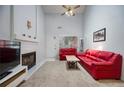 Bright living room with a vaulted ceiling, fireplace, and neutral carpet at 2507 Albion Farm Way, Duluth, GA 30097