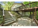 Backyard view featuring a walkout basement, exterior stairs and a deck at 2935 Leafwood Se Dr, Marietta, GA 30067
