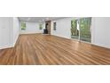 Spacious living room featuring hardwood floors, a cozy fireplace, and sliding doors to the outdoors at 2935 Leafwood Se Dr, Marietta, GA 30067