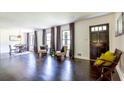 Spacious living room with hardwood floors, large windows, and an inviting seating area at 6715 Wright Rd, Sandy Springs, GA 30328