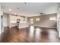 Spacious open-concept living room and kitchen area with hardwood floors and ample natural light at 4627 Piston Sw Jct, Mableton, GA 30126