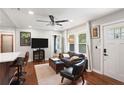Cozy living room with a ceiling fan and plenty of natural light, steps away from the kitchen bar at 1202 Key Se Rd, Atlanta, GA 30316