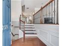 Elegant foyer with hardwood floors, staircase with iron railing, and a welcoming atmosphere at 2325 Limehurst Ne Dr, Atlanta, GA 30319