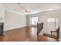 Open-concept living room with hardwood floors, fireplace, and ample natural light at 2325 Limehurst Ne Dr, Atlanta, GA 30319