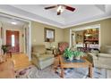 Cozy living room boasts plush seating, hardwood floors, and an inviting open layout at 2149 New London Place Pl, Snellville, GA 30078
