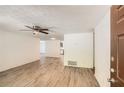 Inviting living room featuring new wood floors, fan, and neutral wall colors at 2948 Sagewood Dr, Snellville, GA 30039