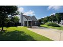 Charming single-story home with well-maintained lawn and a cozy covered entryway at 1972 Brittania Cir, Woodstock, GA 30188