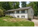 Split-level home with attached garage, landscaped front yard, and inviting entrance at 2795 Bentwood Dr, Marietta, GA 30062