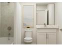 Bright bathroom featuring a shower/tub combo and a modern vanity with sink at 2276 Linden Pass, Douglasville, GA 30135