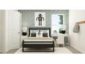 Modern bedroom with bed, white desk, and stylish decor at 2276 Linden Pass, Douglasville, GA 30135