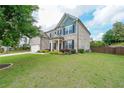 Well maintained two-story home with beautiful landscaping and an attached garage at 5789 Creek Indian Dr, Sugar Hill, GA 30518