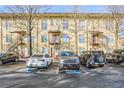 Apartment building featuring three levels with parking in front and exterior stairs at 1195 Milton Se Ter # 2203, Atlanta, GA 30315