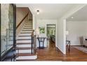 Bright foyer features hardwood floors, staircase, and views of living spaces at 3145 Indian Hills Ne Dr, Marietta, GA 30068