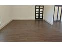 Open living area with beautiful wood floors, neutral walls, and ample natural light at 4590 River Stone Trl, Douglasville, GA 30135