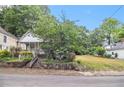Charming home with a stone-accented yard, offering classic appeal and a inviting entrance at 1052 Curran Nw St, Atlanta, GA 30318