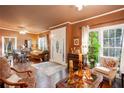 Spacious living room with hardwood floors, classic furniture, and large windows at 791 E Main Street, Canton, GA 30114