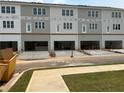 New townhomes with attached garages and modern gray and white color scheme at 3336 Cranston Ln, Kennesaw, GA 30144
