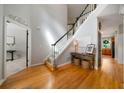 Bright foyer with hardwood floors, staircase with dark handrail, and an inviting ambiance at 685 Sienna Dr, Cumming, GA 30040