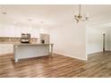 Bright kitchen featuring stainless steel appliances, island, and open layout at 8394 Banks Mill Rd, Douglasville, GA 30135