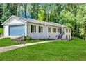 Charming single-Gathering home with garage, green grass and manicured landscaping at 2418 Bolling Brook Sw Dr, Atlanta, GA 30311