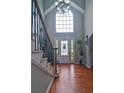 Bright foyer featuring hardwood floors, a staircase with rod iron spindles, and a high ceiling at 2420 Westport Cir, Marietta, GA 30064