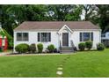 A charming home boasts a freshly mowed lawn and well-manicured landscaping at 429 Deckner Sw Ave, Atlanta, GA 30310