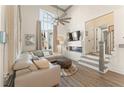 Bright living room features high ceilings, fireplace, and large windows offering plenty of natural light at 1907 Galt, Kennesaw, GA 30144