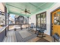 Inviting covered front porch with ceiling fan, rocking chairs, and stylish decor for relaxing outdoors at 1907 Galt, Kennesaw, GA 30144